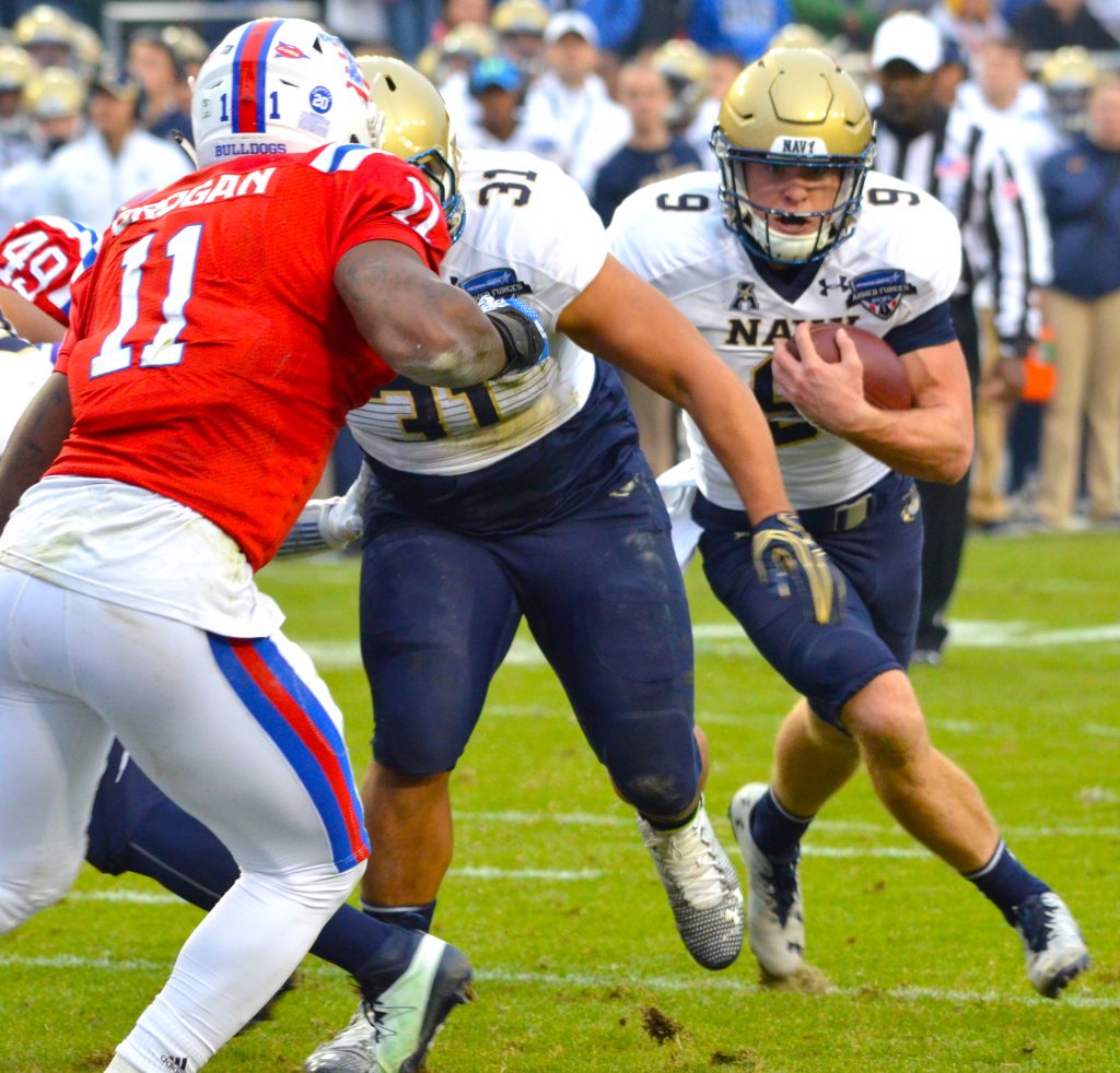 Zach Abey, QB, Navy rolls around for yards.